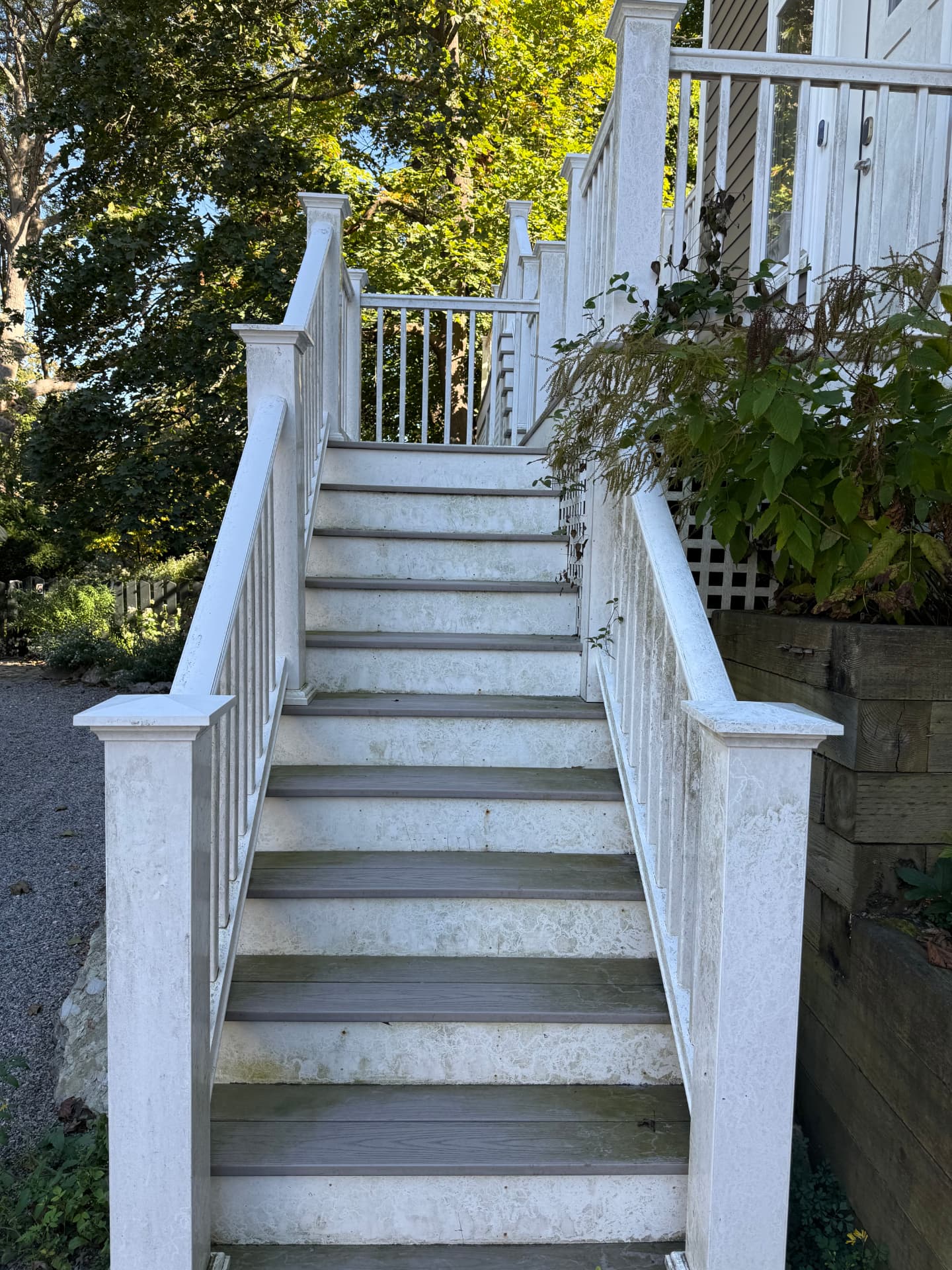 White deck steps and railings stained with grime before cleaning